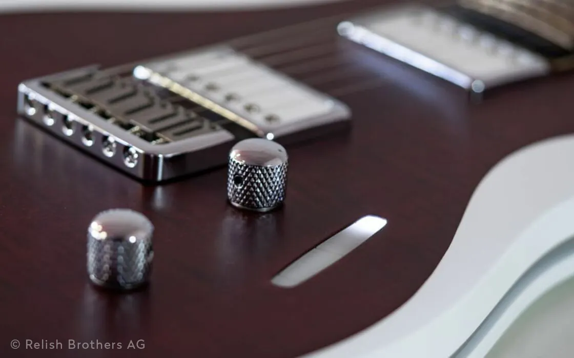 Detail of the Mary electric guitar with bridge, controls and touch control